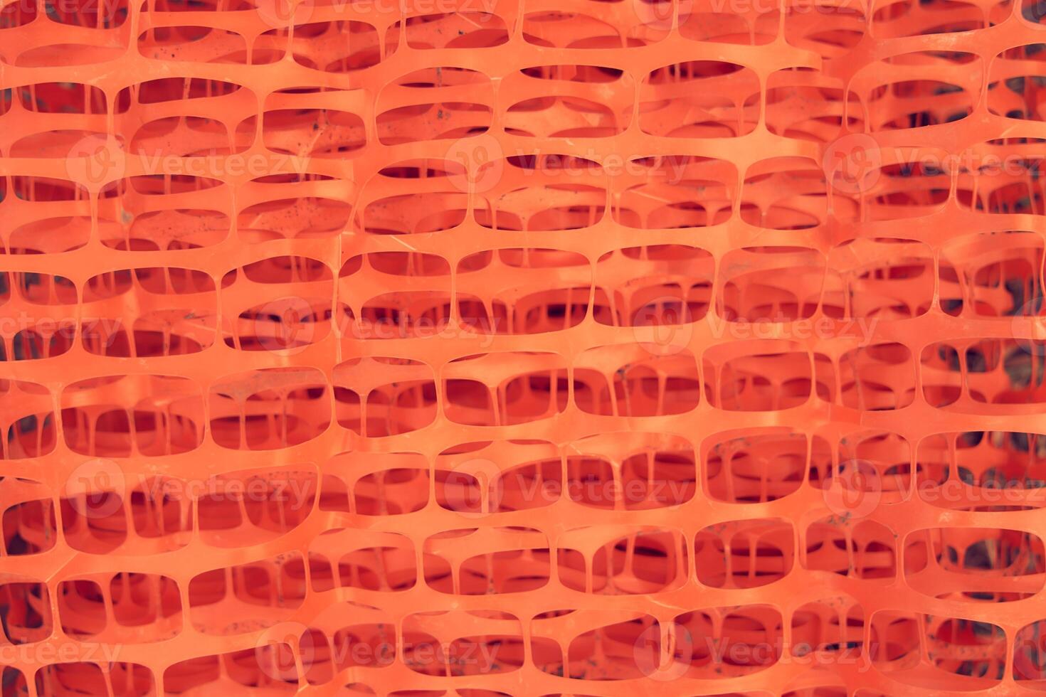 Reinforcing mesh for plaster. Orange construction mesh in rolls in a hardware store. Mesh for reinforcing walls in the process of their insulation, rolled into a roll. photo