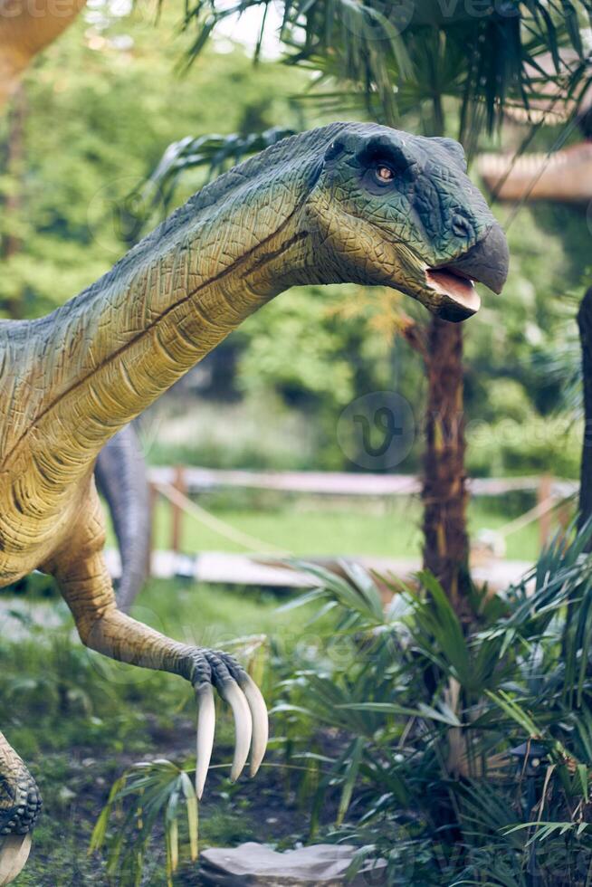 Head close-up Therizinosaurus is a predatory dinosaur species with hypertrophied nails, the strangest dinosaur from the very end of the Cretaceous period. Close-up with copy space photo