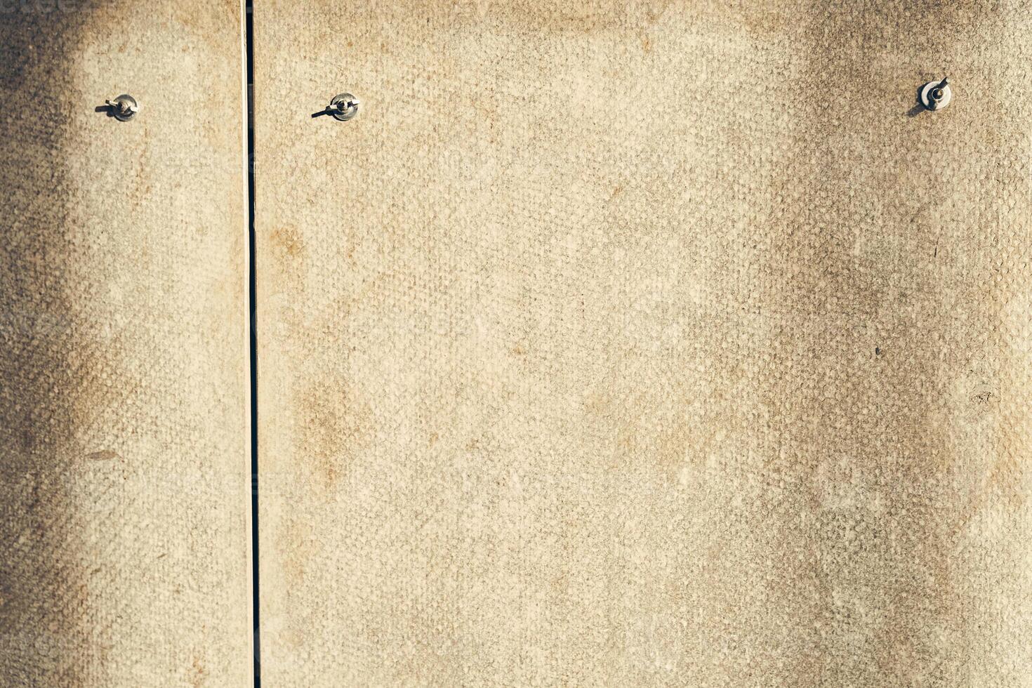 The back side of the plywood is made of fiberboard. Background texture. Textured sheet made of MDF, abstract backgrounds. Texture of the reverse side of the fiberboard sheet photo