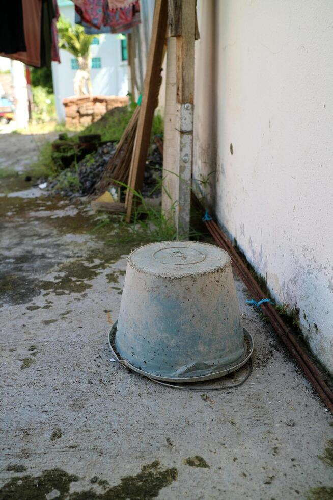 The Dirty used cement bucket, upside down outside photo