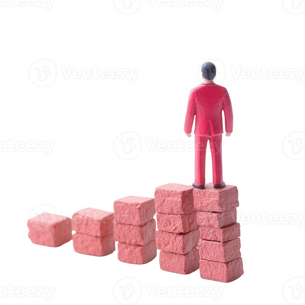 A figurine standing atop building blocks, symbolizing growth and achievement. png