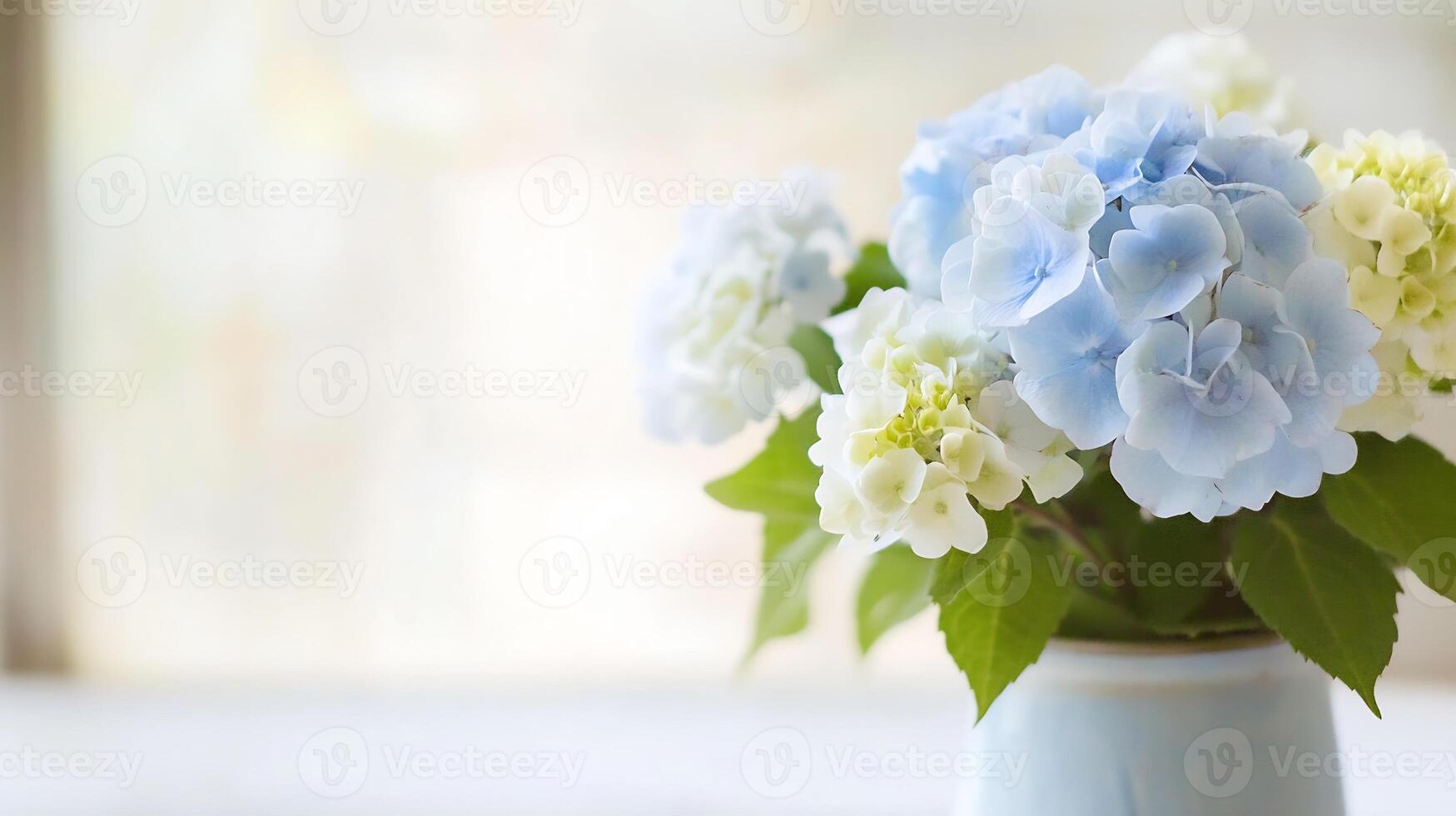 Soft Hydrangeas in Pastel Blue and White Hues in Elegant Indoor Vase Arrangement photo