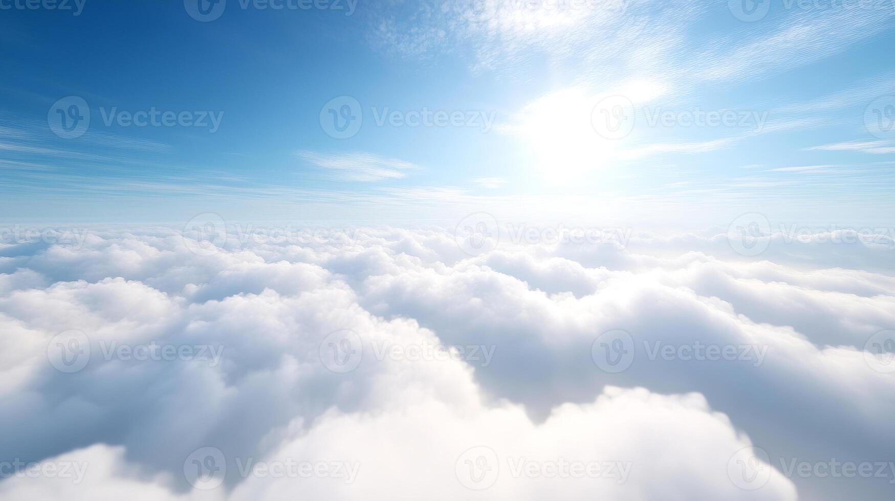 Vast White Cloud Oceans Under a Bright Blue Sky Illuminated by Sunlight photo