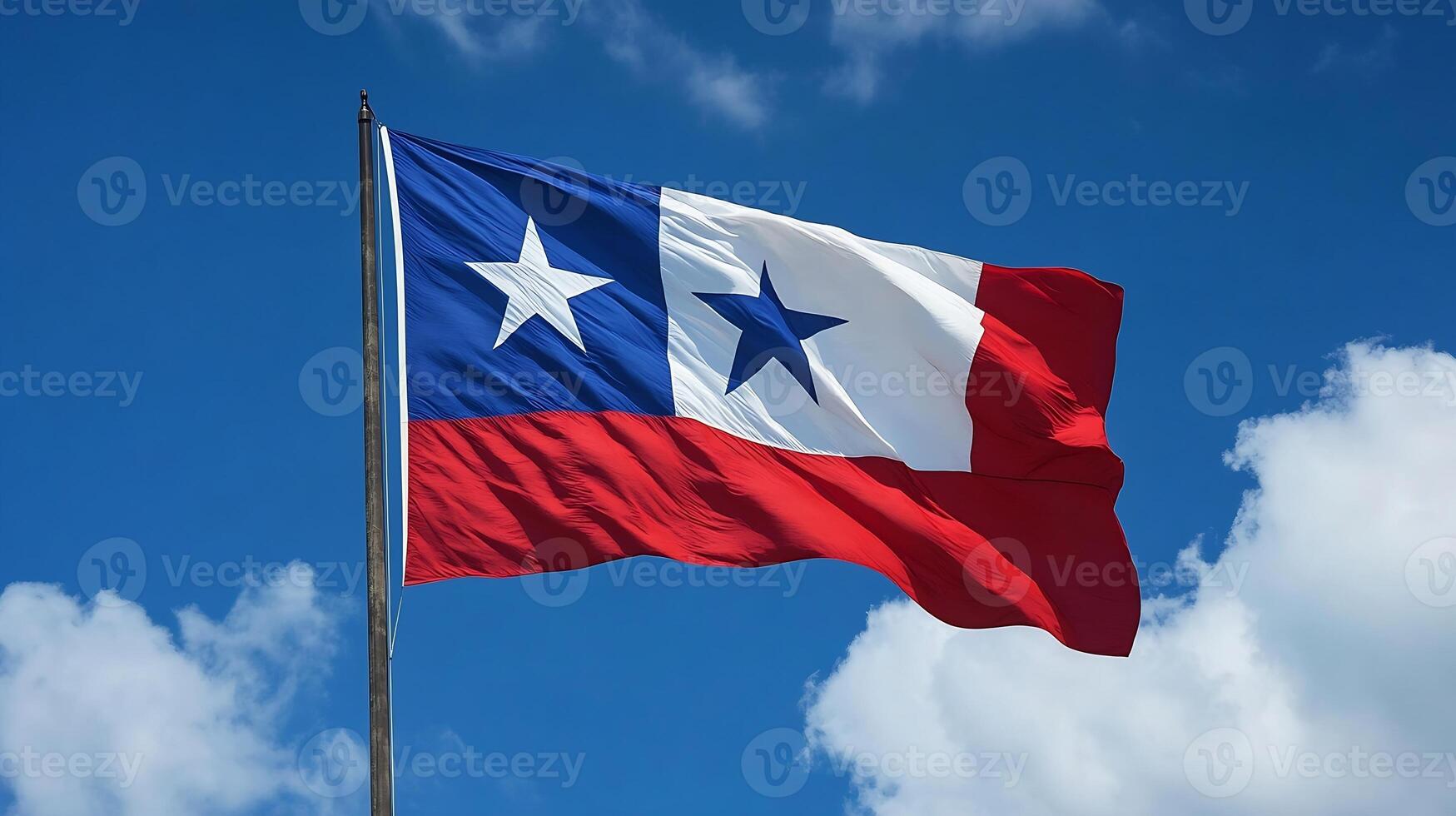 Patriotic Flag with Stars Against a Vibrant Blue Sky and Fluffy White Clouds photo