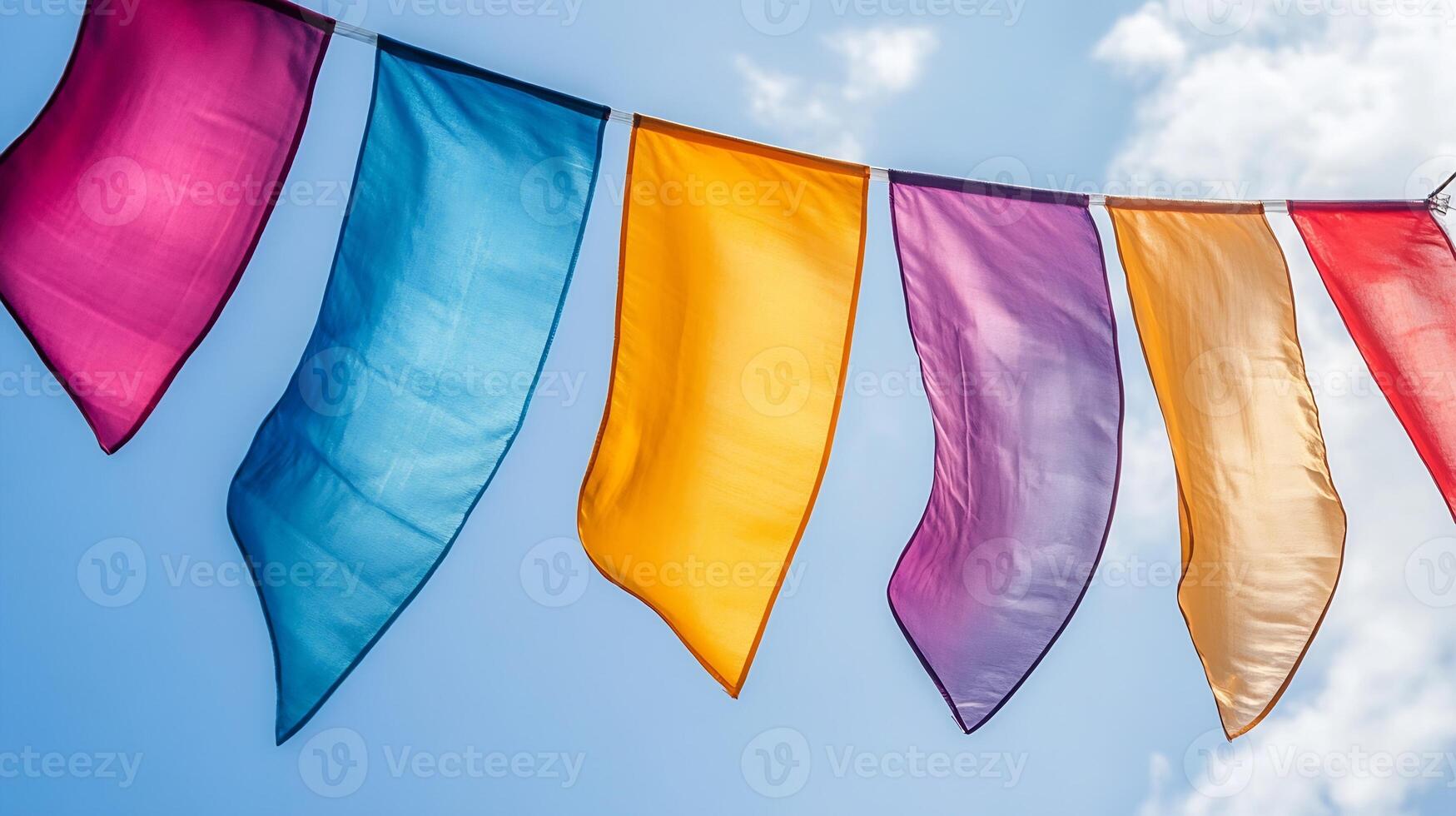 Brightly Colored Wind Flags Flying Happily in the Sunny Sky photo