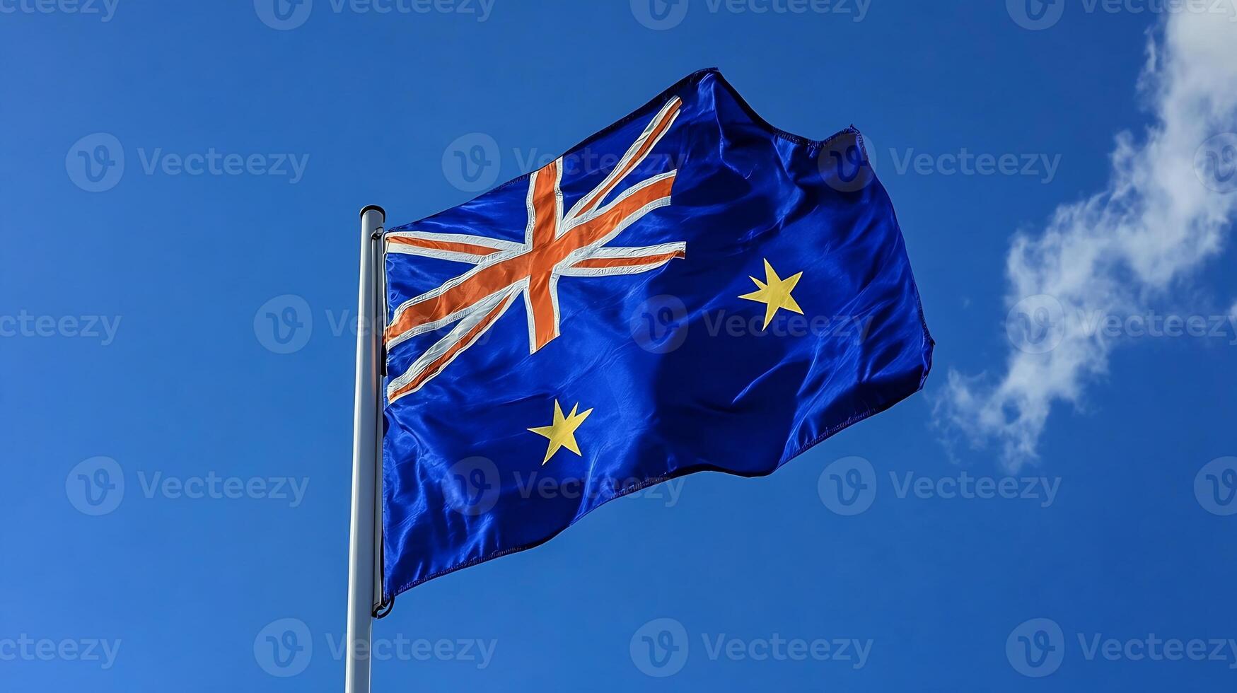 Australasian Flag Waving Under Bright Clear Sky on a Sunny Day photo