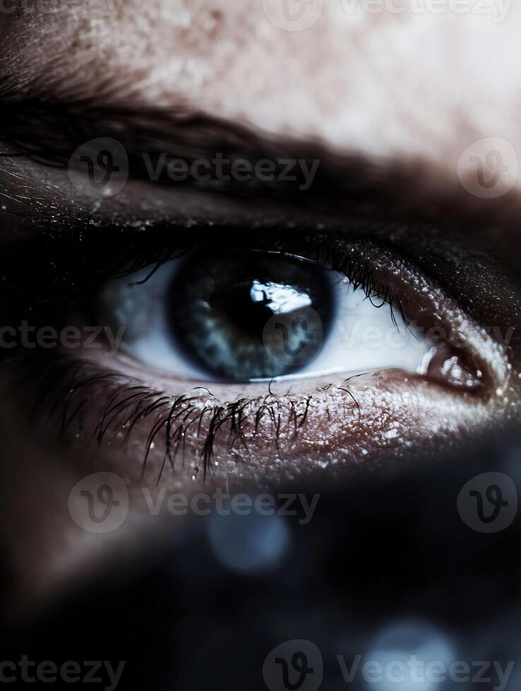 Close up of a human eye with intense gaze and detailed focus on lashes and iris texture photo
