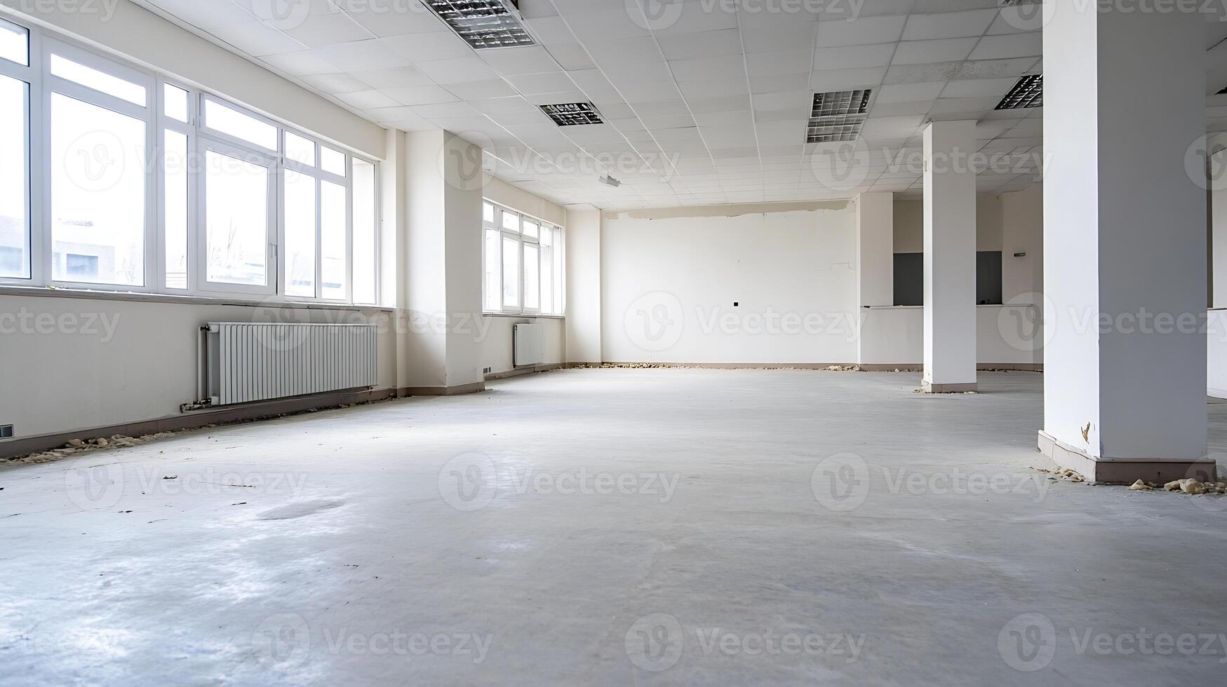 Spacious Empty Office Space With Large Windows and White Walls Ideal for Commercial Use photo