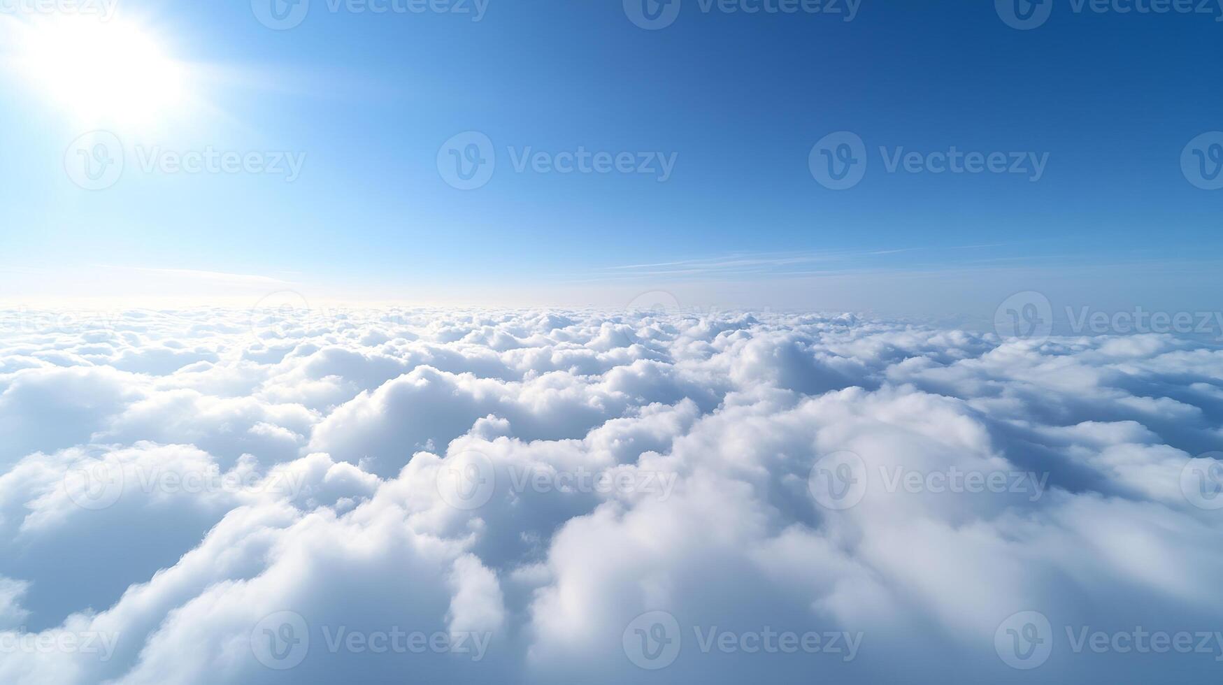Expansive View of Puffy White Clouds Under a Bright Sunlit Sky photo