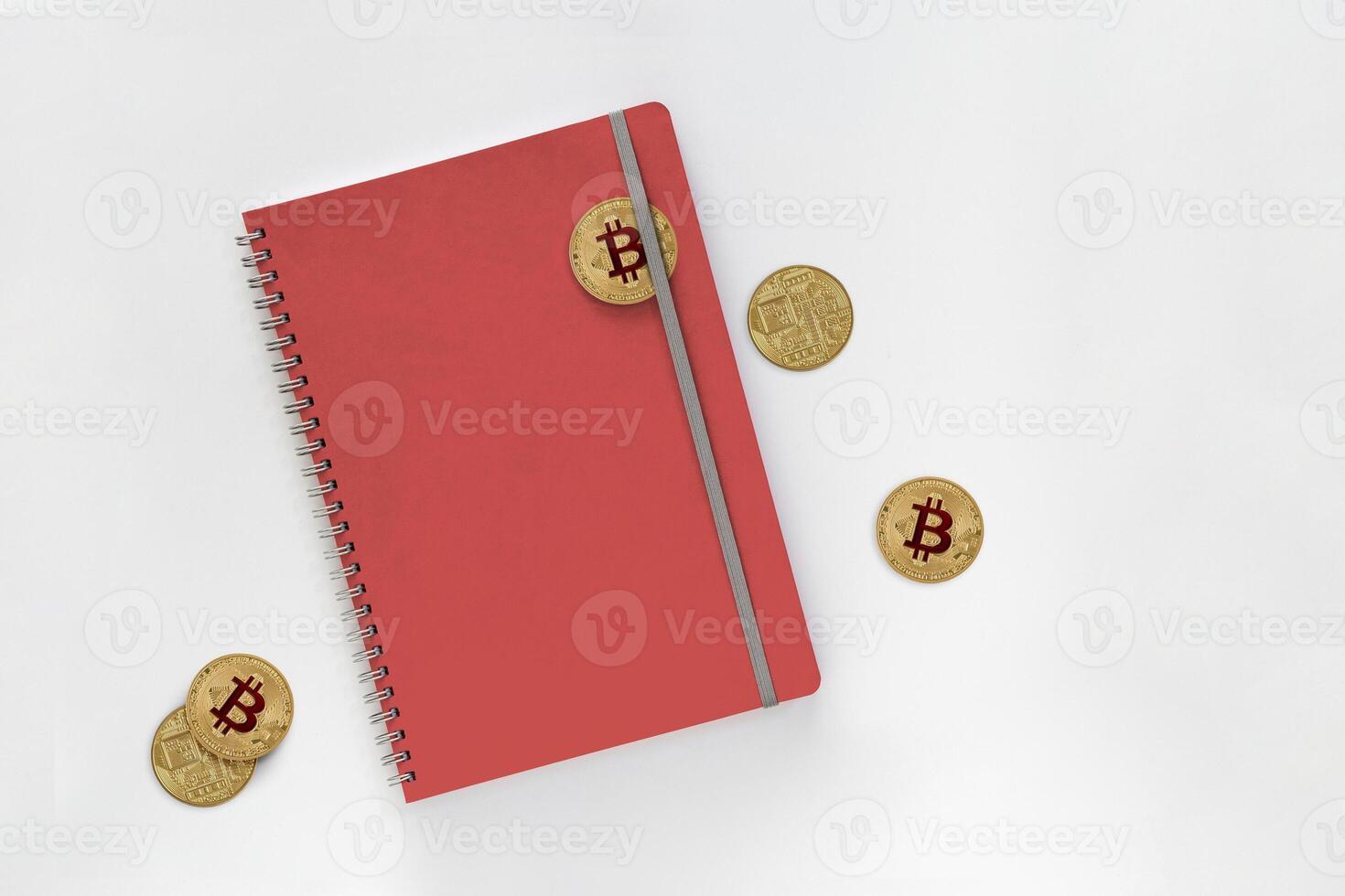 3d illustration of Bitcoins with red leather notebooks isolated on gray background. with clipping path photo