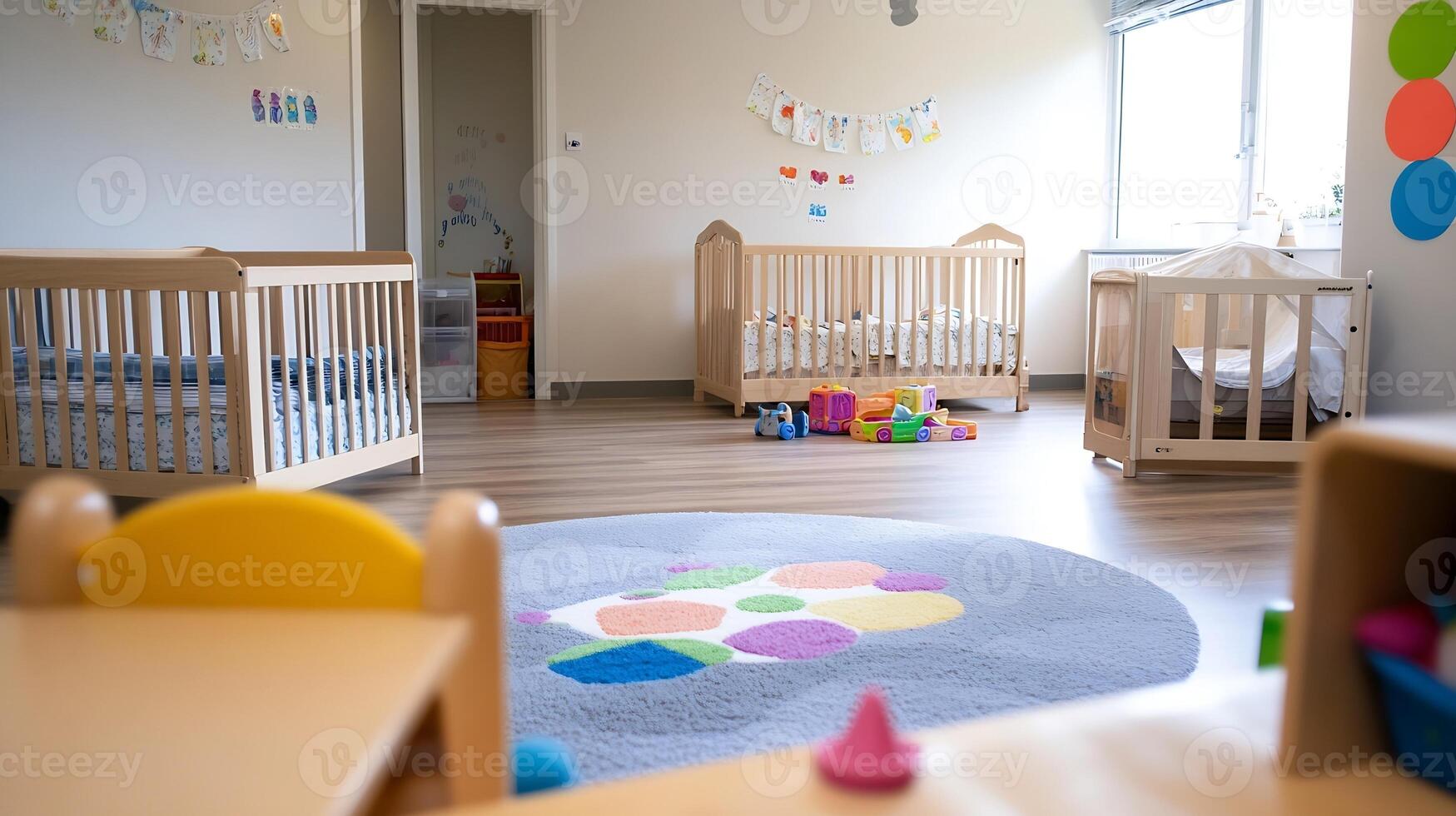 Spacious and Colorful Nursery Playroom with Toys and Comfortable Cribs photo