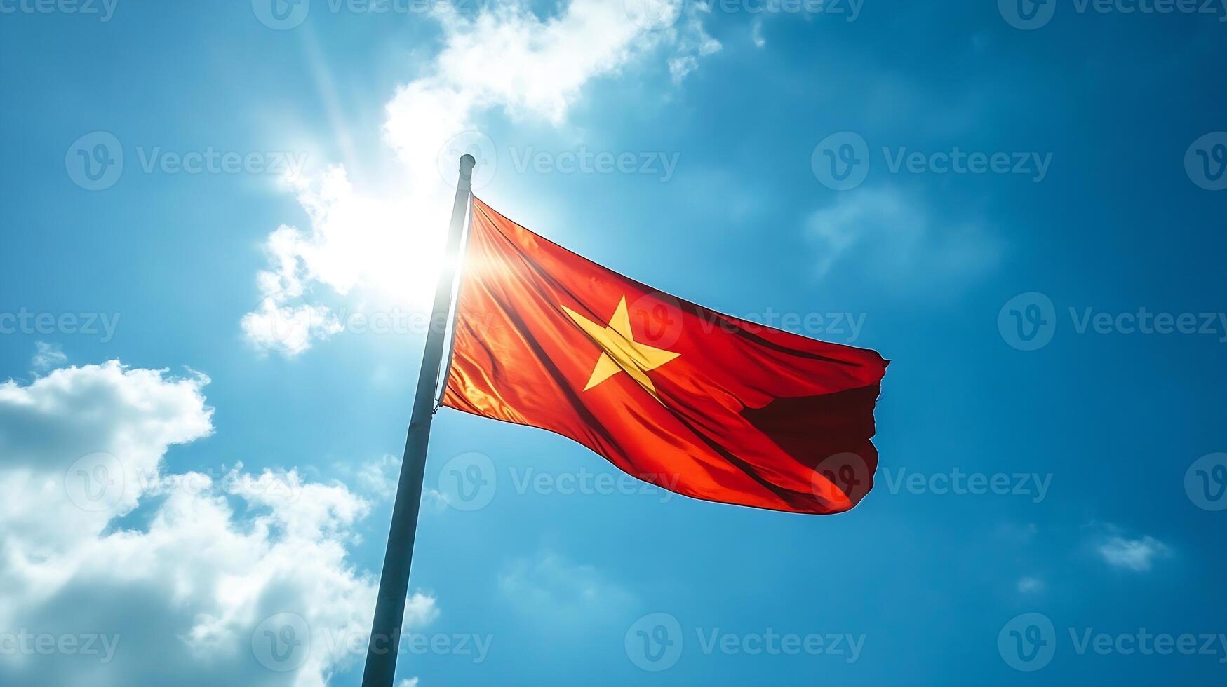 Vietnamese flag flying high in bright blue sky symbolizing national pride and unity photo