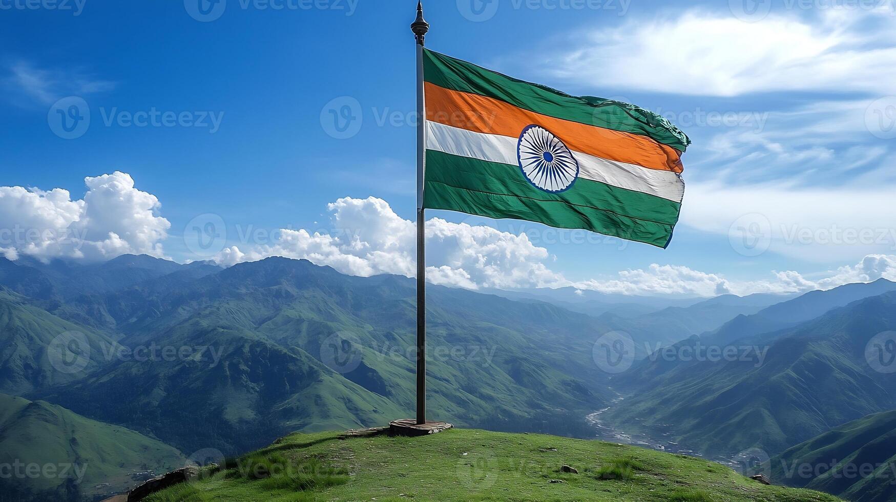 Indian National Flag Waving Proudly on a Mountain Top with Blue Sky and Clouds Background photo