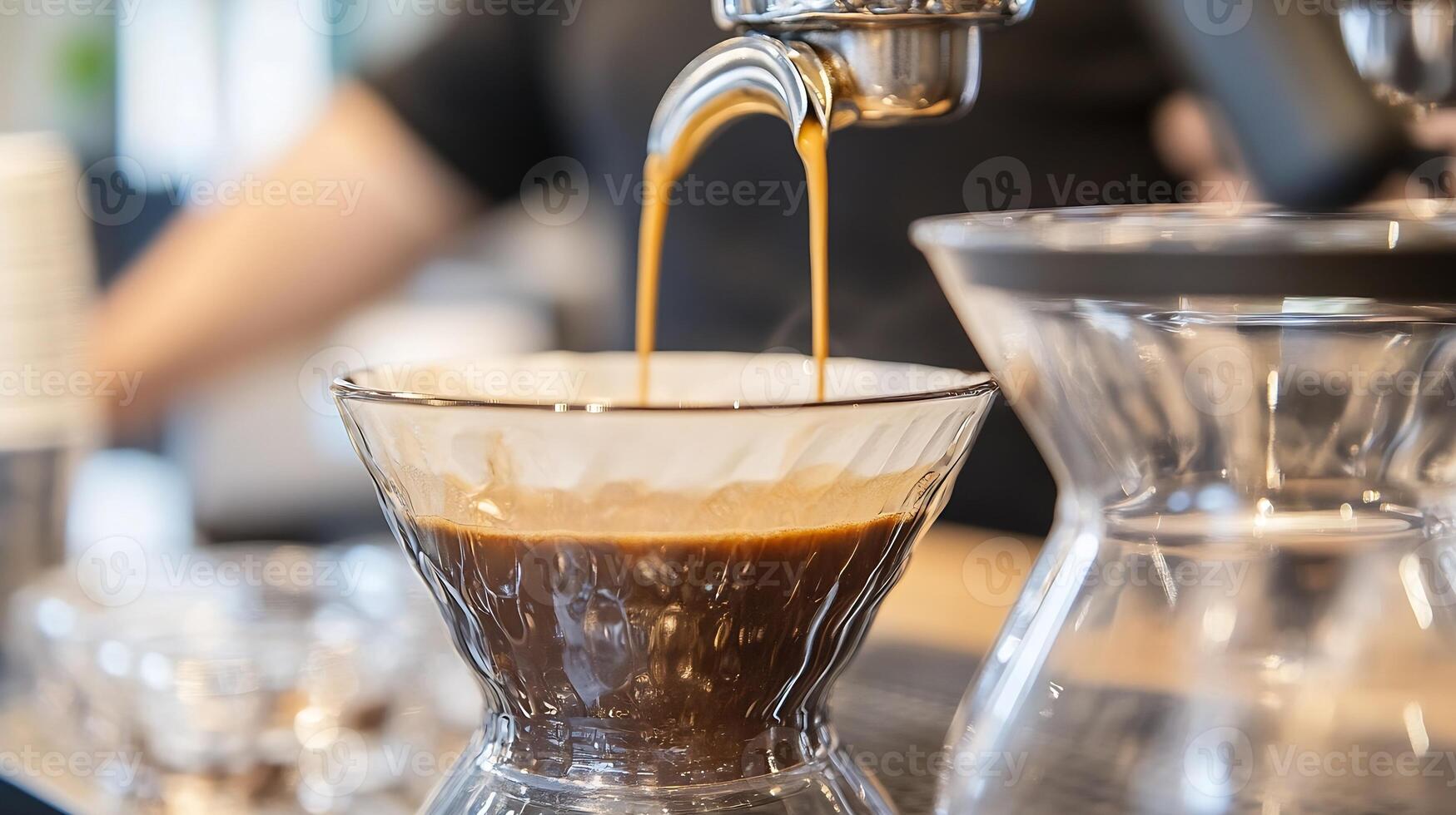 Creamy Espresso Pouring in Transparent Glass Coffee Maker with Rich Aroma and Texture photo