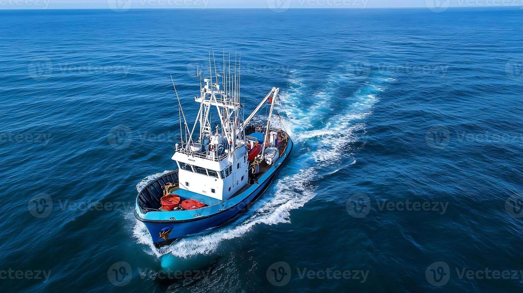 Commercial Fishing Boat Navigating the Open Sea with Trawling Nets Deployed photo
