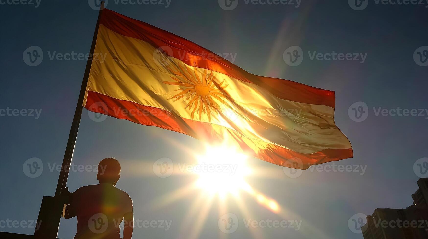 Argentinian flag in silhouette against a bright sunlit sky representing national pride photo
