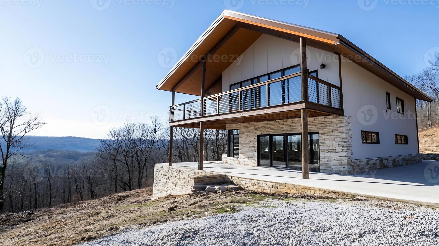Modern Hilltop Home with Expansive Glass Windows Overlooking Scenic View photo