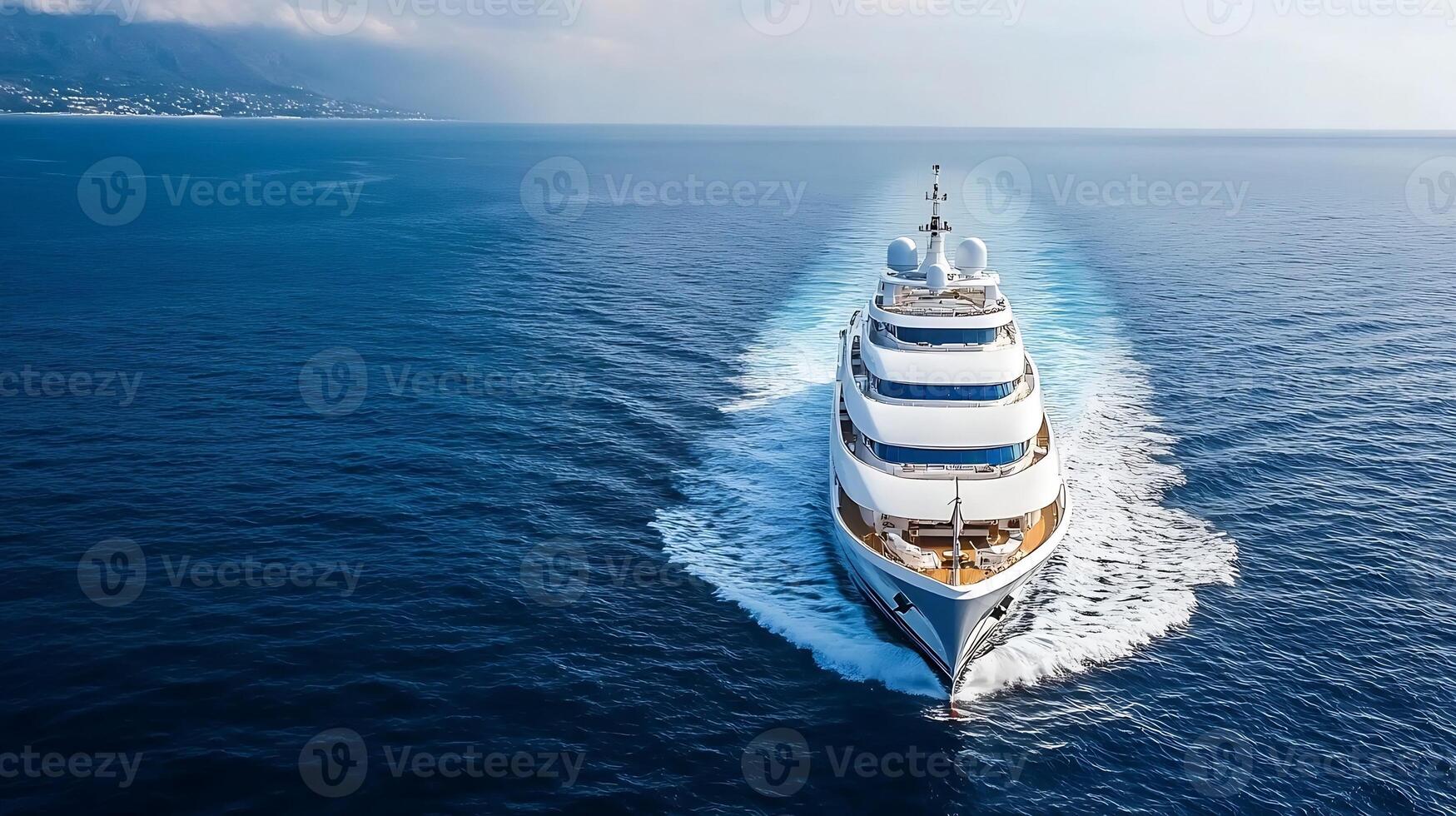 Aerial view of luxury yacht navigating in open blue ocean waters photo