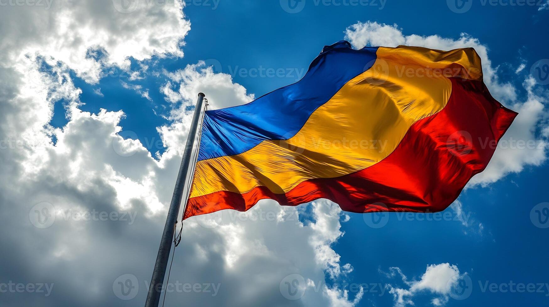 Colorful Flag Fluttering in Deep Blue Sky with Thick Clouds photo