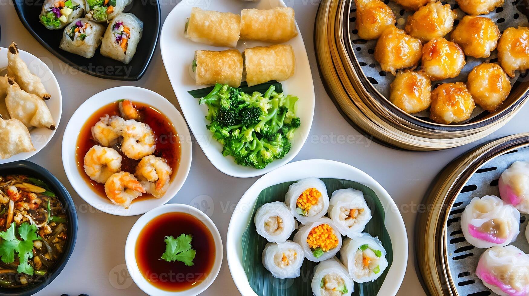 Assortment of Delicious Asian Dim Sum and Appetizers on Elegant Dining Table photo