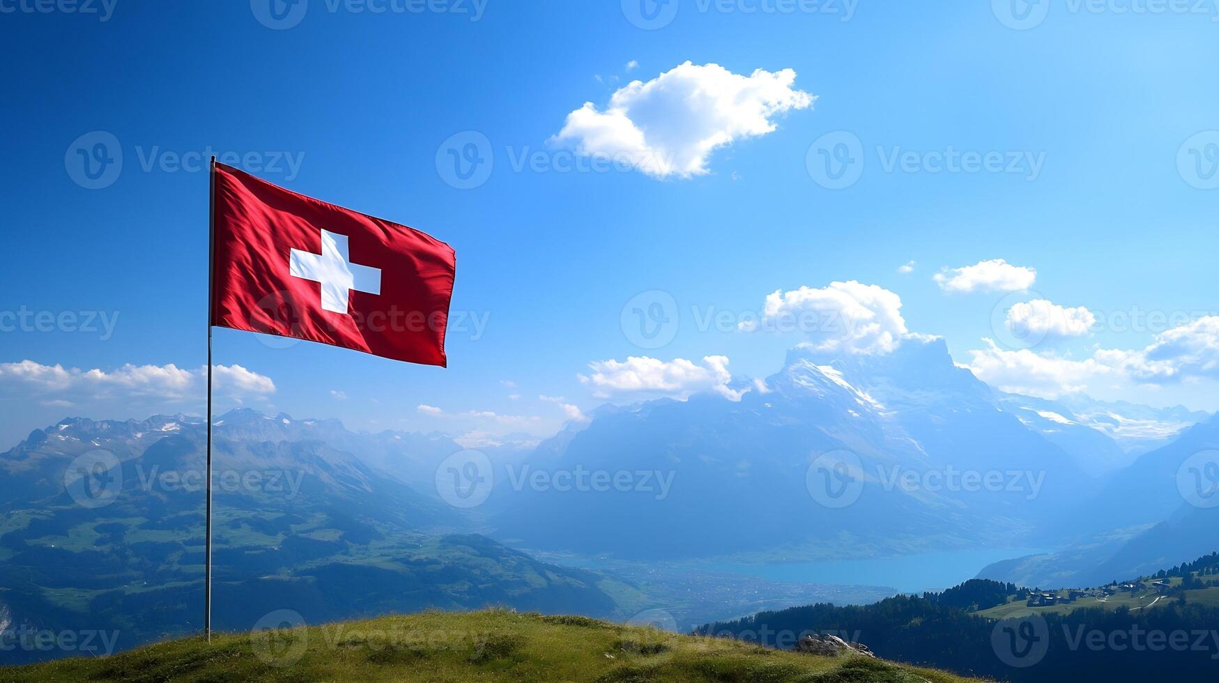 Majestic Swiss Flag Waves Against Clear Sky with Alpine Mountain Range in Background photo