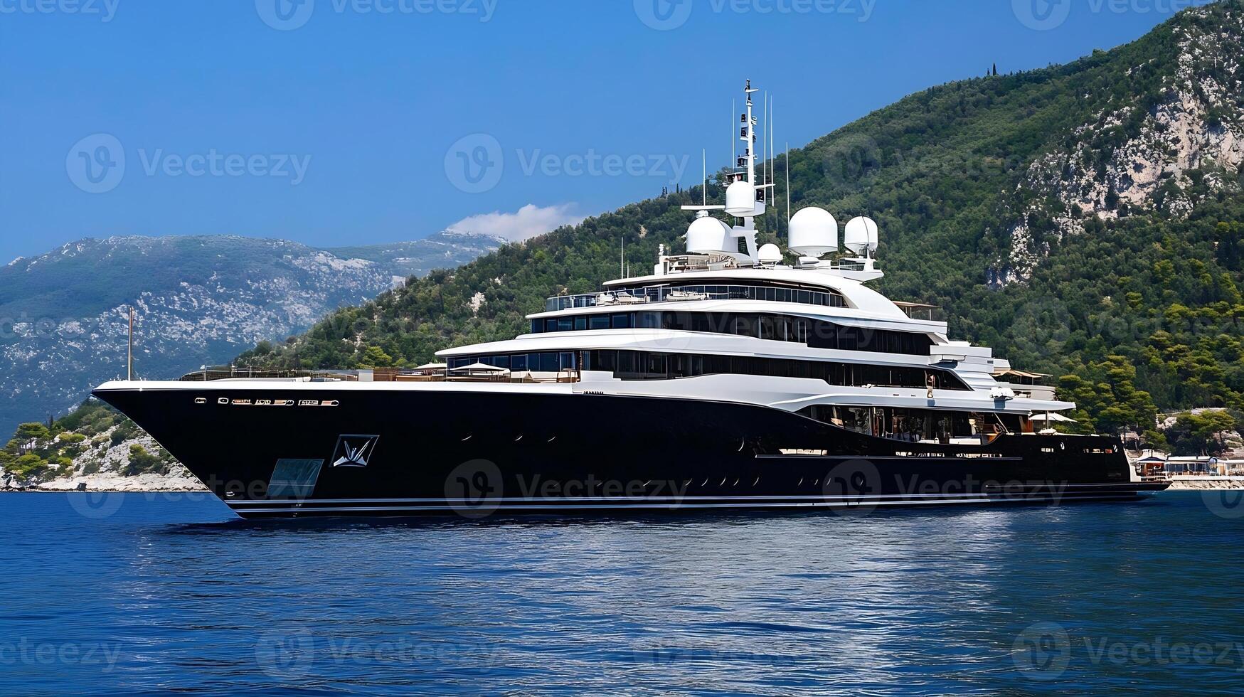 Private Luxury Yacht Anchored in Scenic Bay with Mountainous Background photo