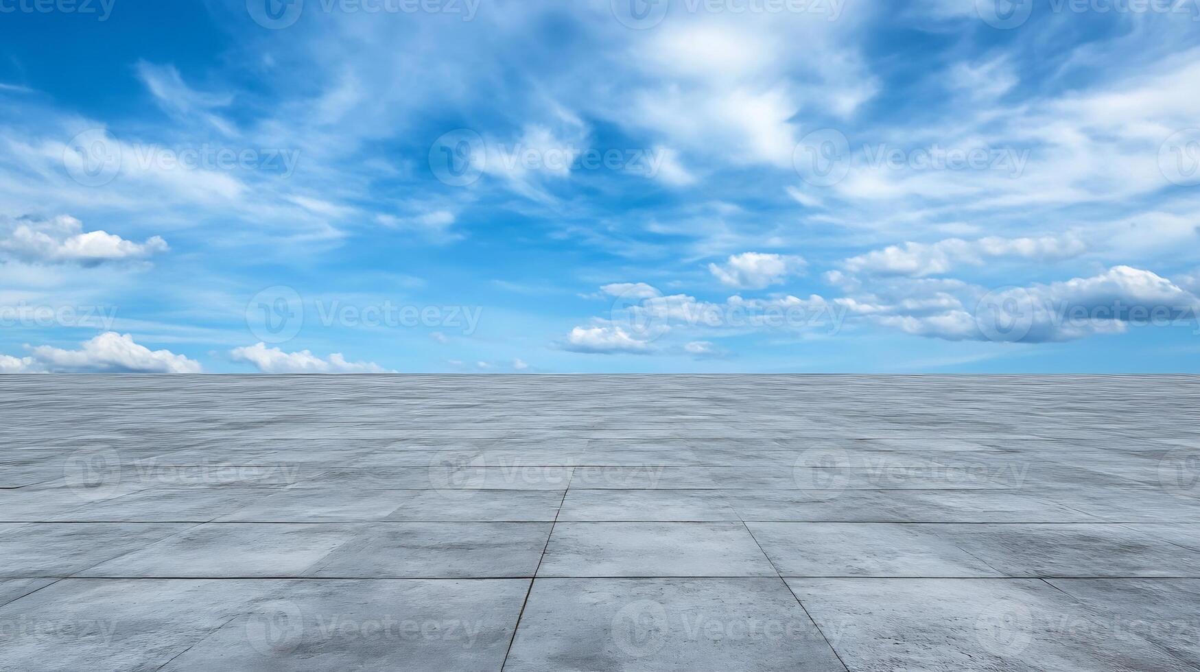 Vast Concrete Surface with Beautiful Blue Sky and Clouds Expanding Horizon photo
