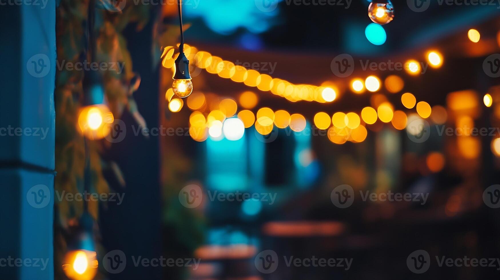 String Lights Creating Warm Ambiance in Outdoor Night Setting with Bokeh photo