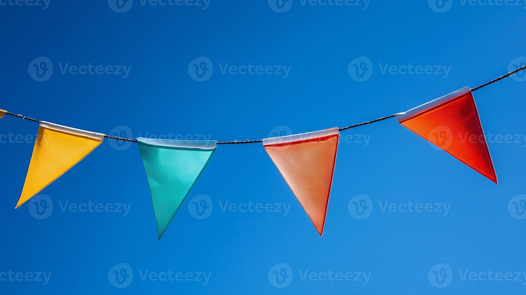 Colorful Triangular Pennant Flags Against Clear Blue Sky Celebrating Outdoor Festival photo