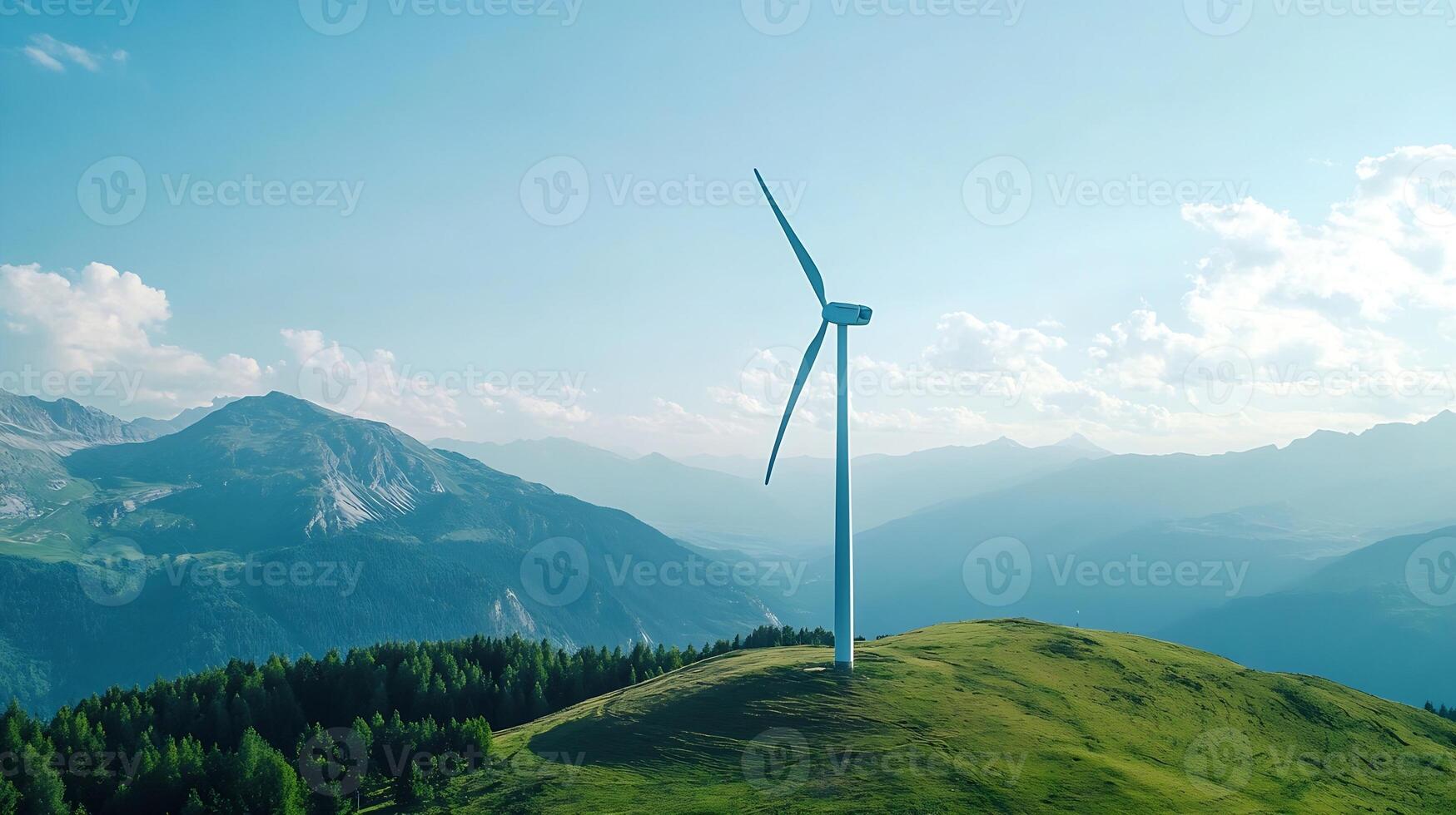 Single wind turbine on grassy hill with mountains in the background photo