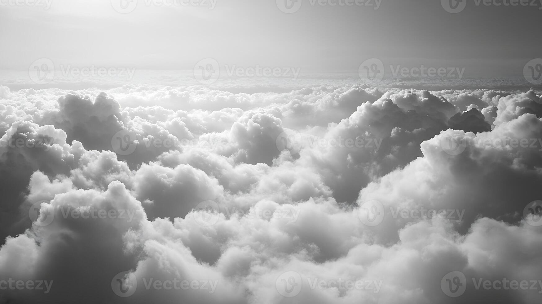 Ethereal Monochrome Cloudscape Horizon with Fluffy Clouds Illuminated by Sunlight photo