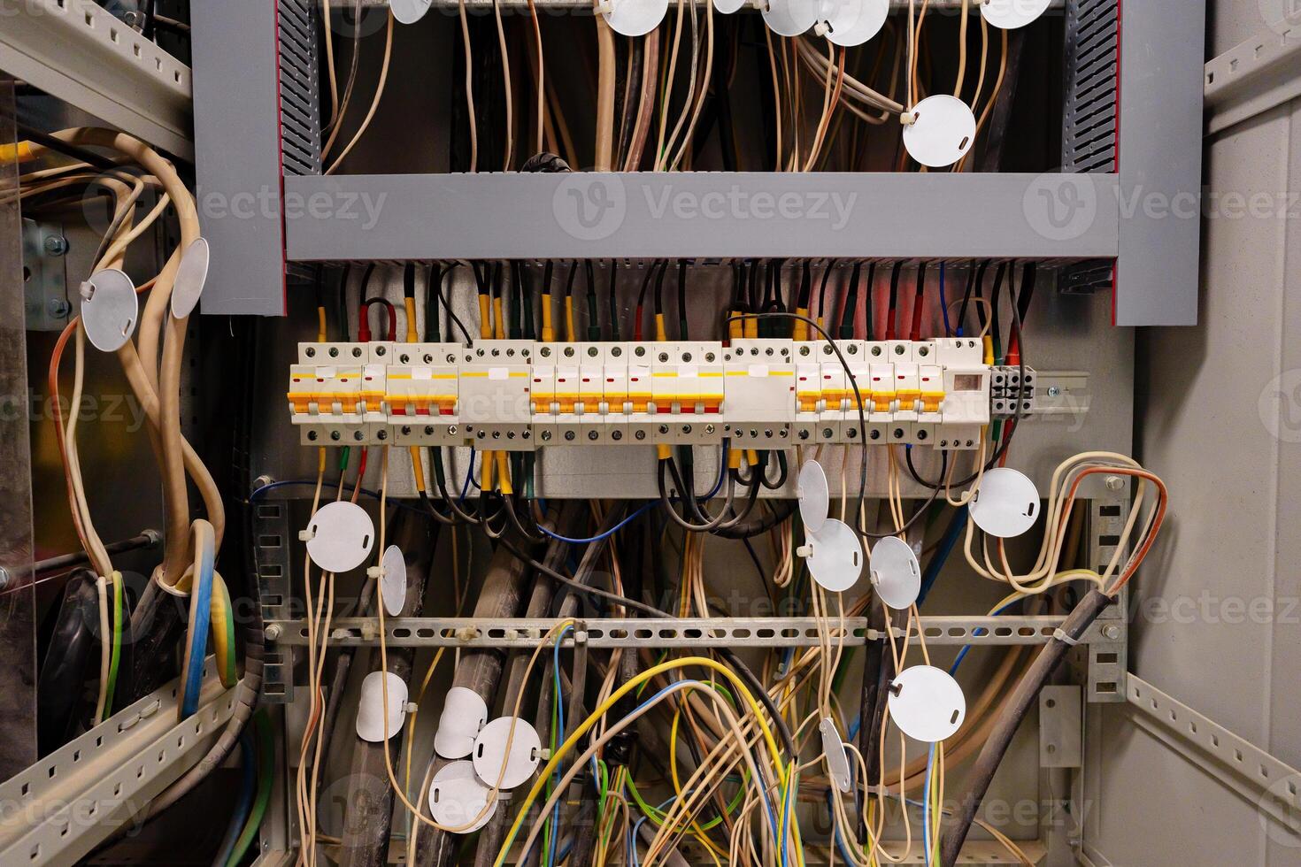Close view of complex electrical wiring in a control panel at a technology facility photo