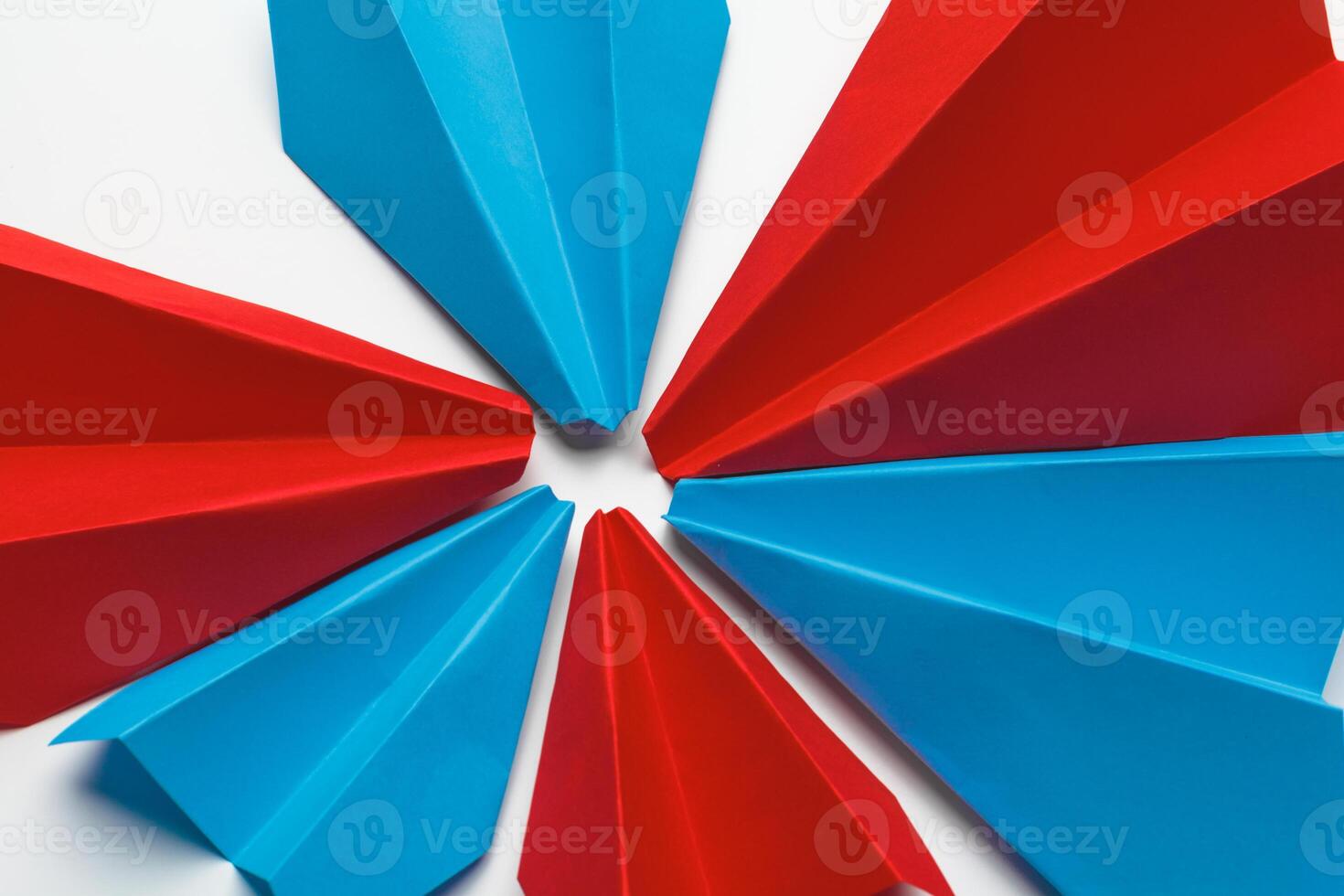 Red and blue paper planes on white background. Leadership and Business competition concepts photo