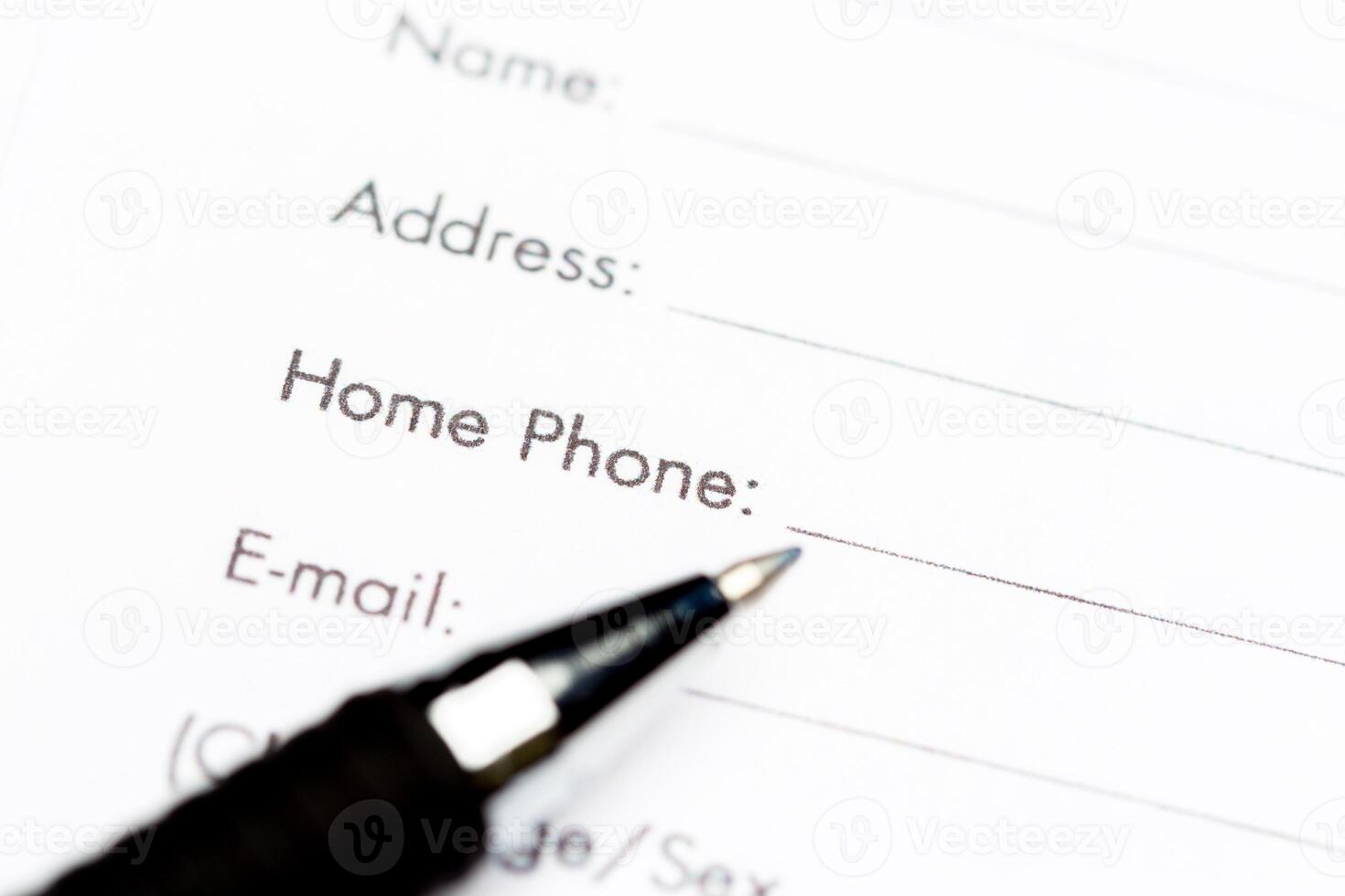 Close-up of pen on contract photo