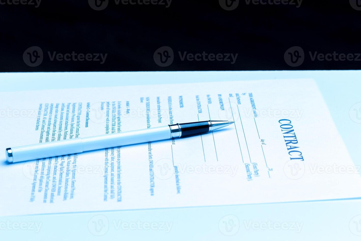 Close-up of pen on contract. photo