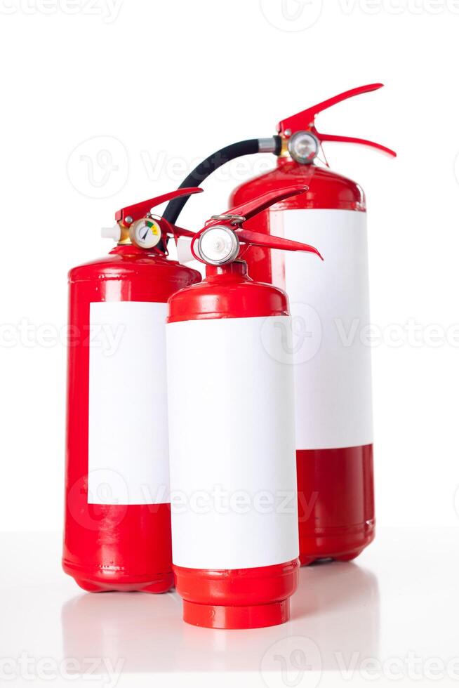 Three fire extinguisher isolated on white background photo
