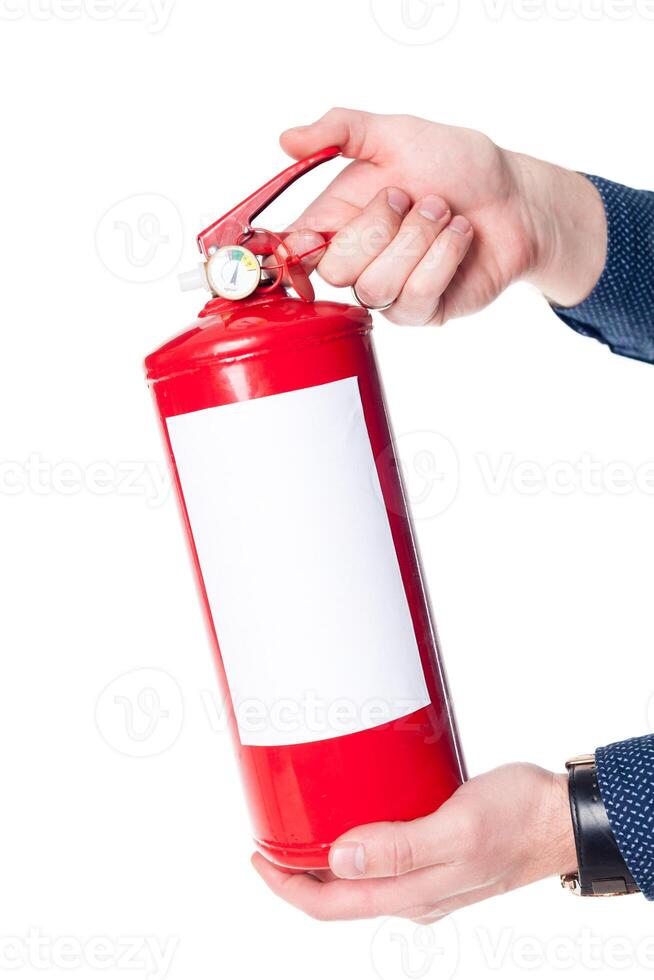 Man using fire extinguisher isolated on white photo
