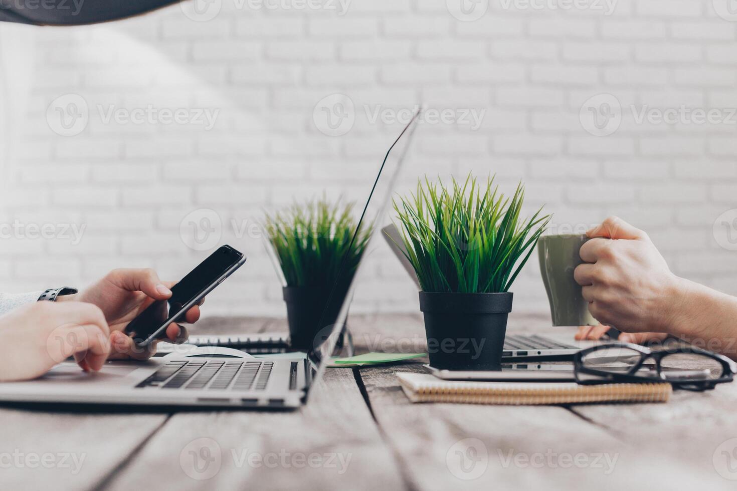 Businesspeople working on their computers. the view from the top photo