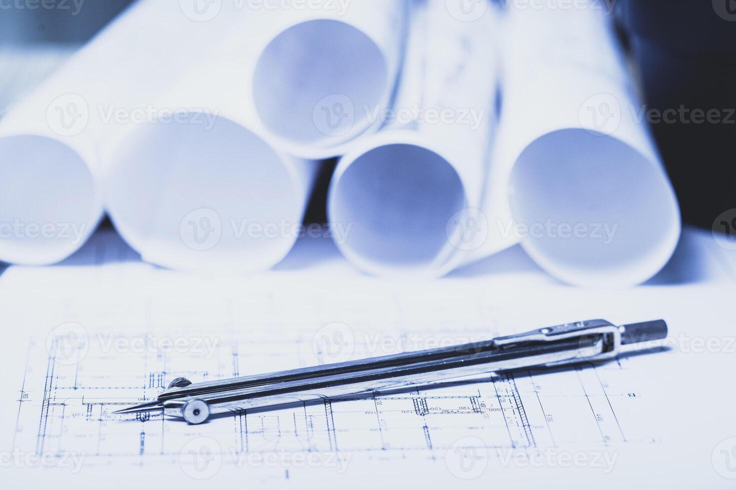 stack of white construction blueprints photo