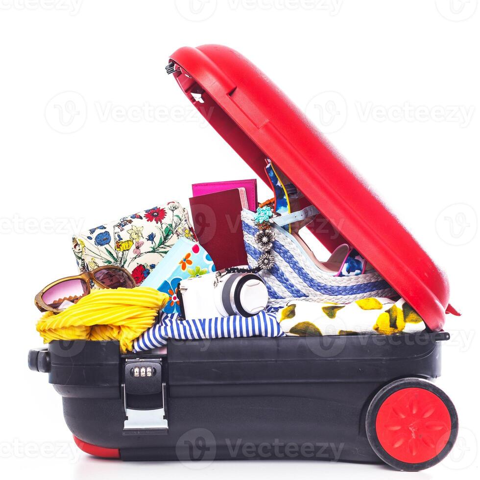 Packing suitcase for trip isolated on white photo