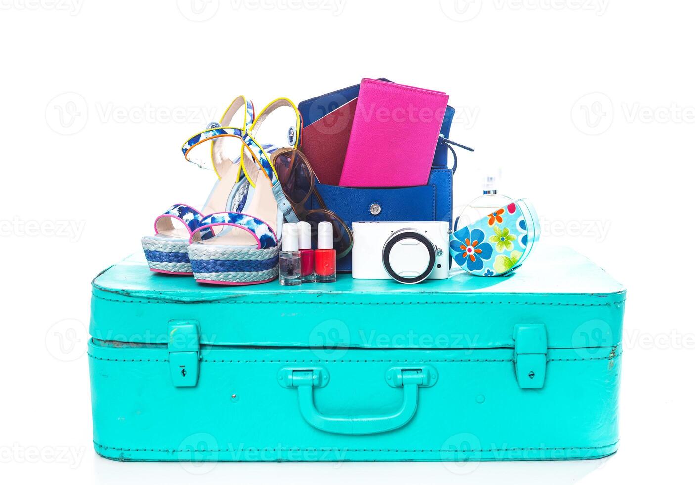 Packing suitcase for trip isolated on white photo