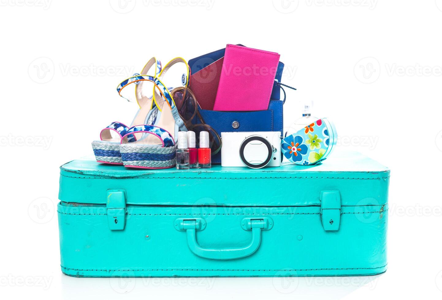 Packing suitcase for trip isolated on white photo