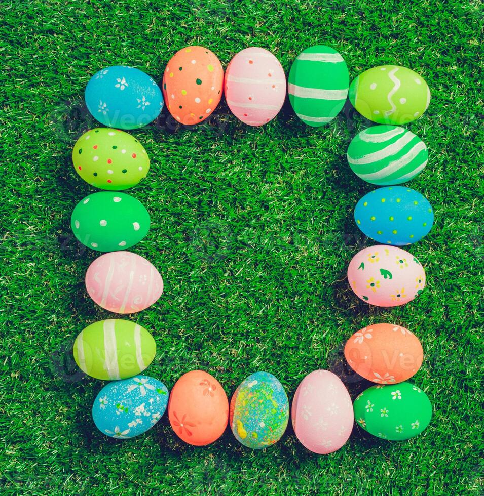 Colorful easter eggs on green grass photo