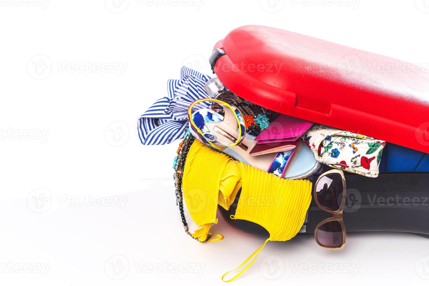 Packing suitcase for trip isolated on white photo