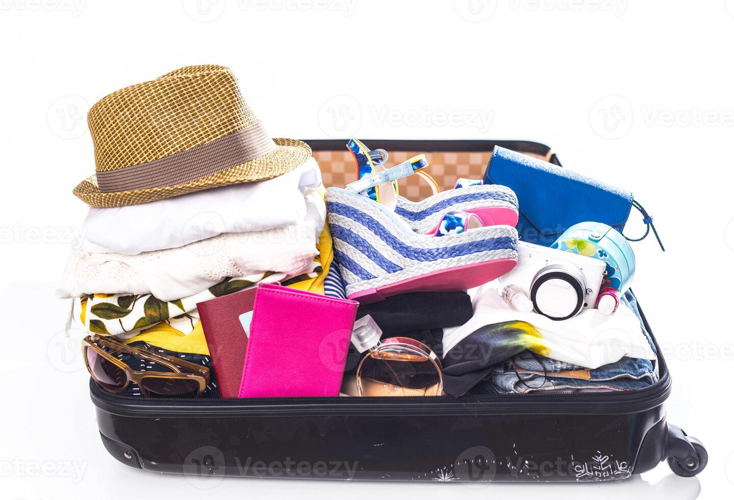 Packing suitcase for trip isolated on white photo