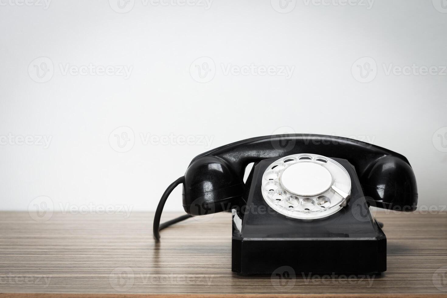 Retro telephone on table photo