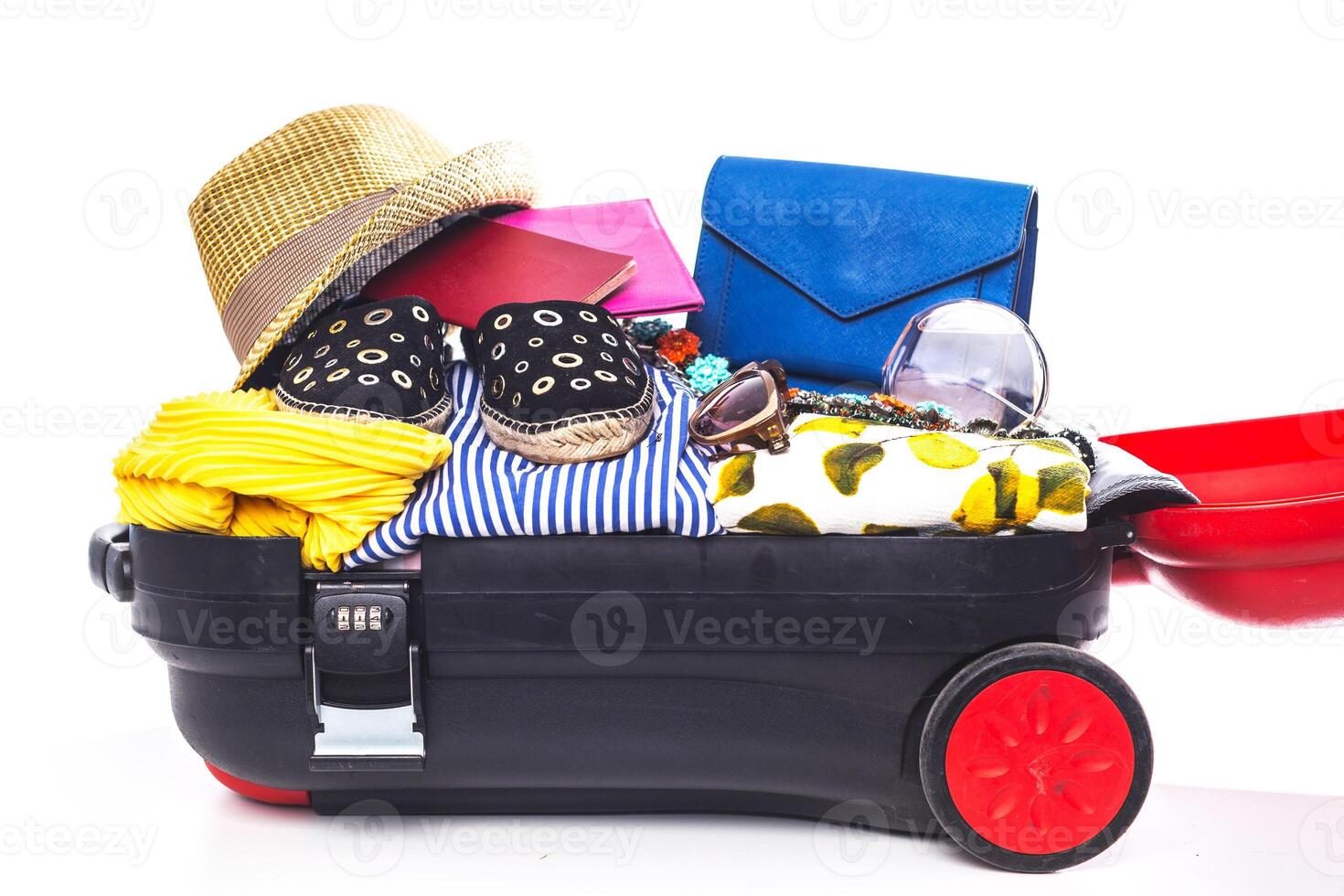 Packing suitcase for trip isolated on white photo
