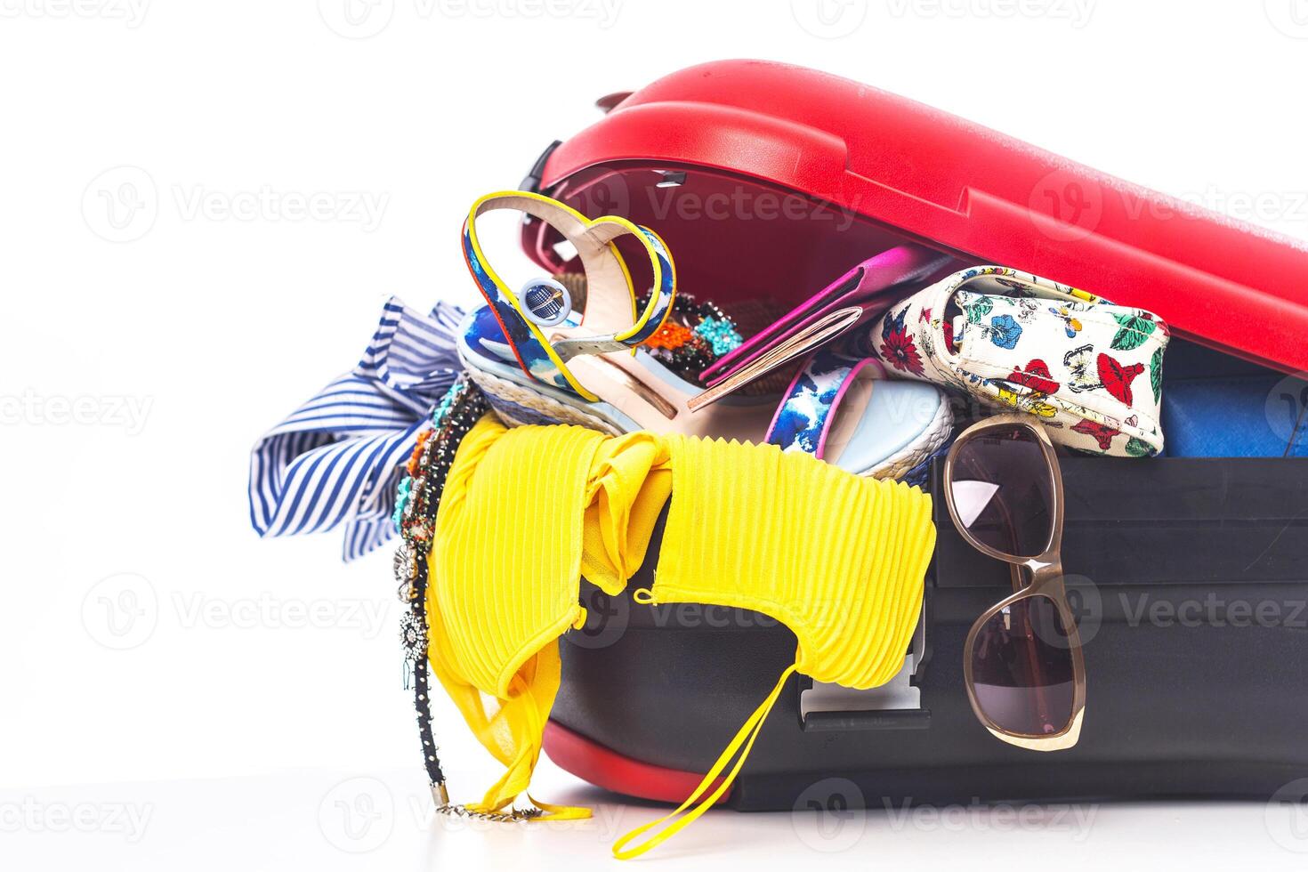 Packing suitcase for trip isolated on white photo