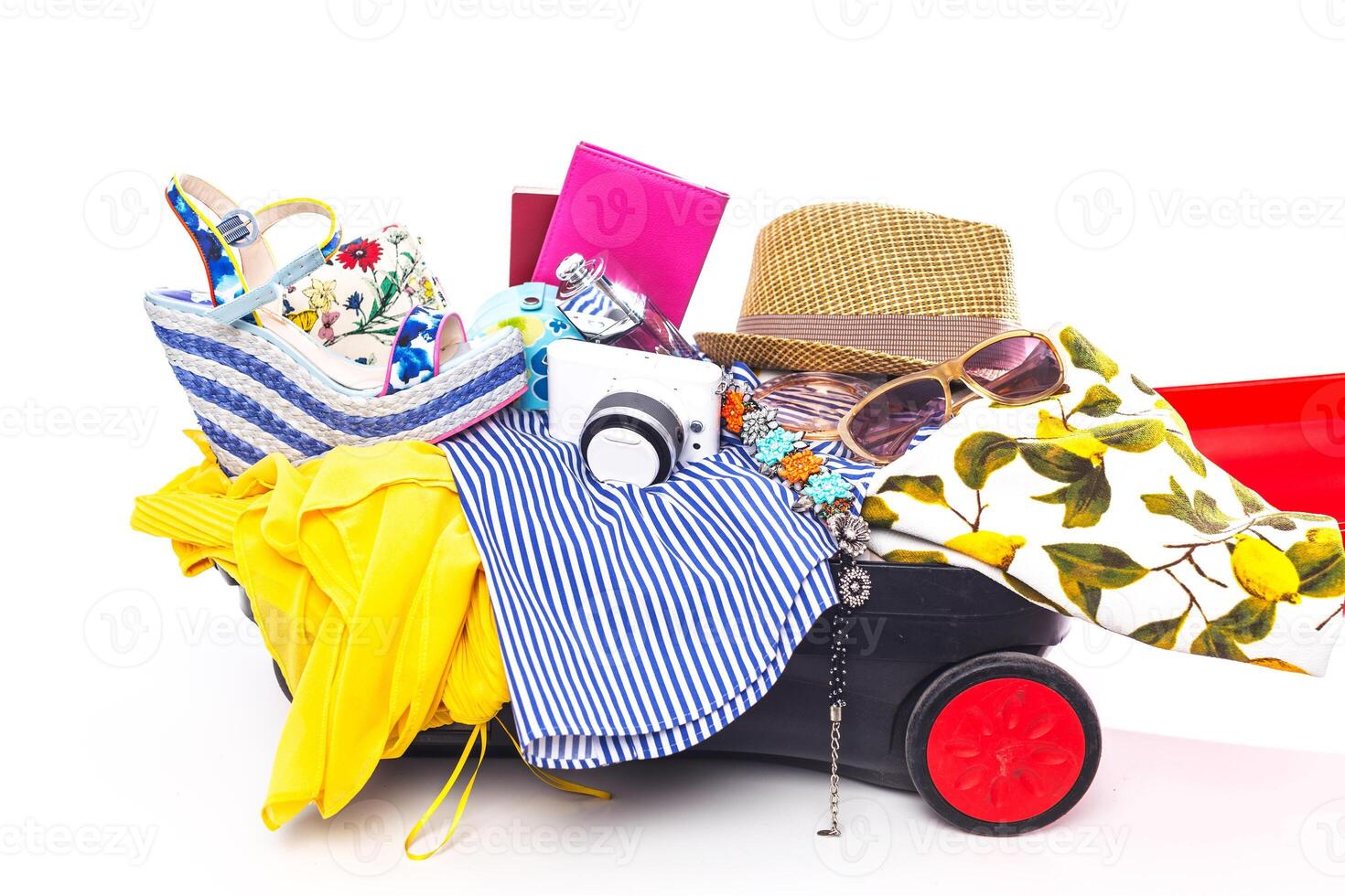Packing suitcase for trip isolated on white photo