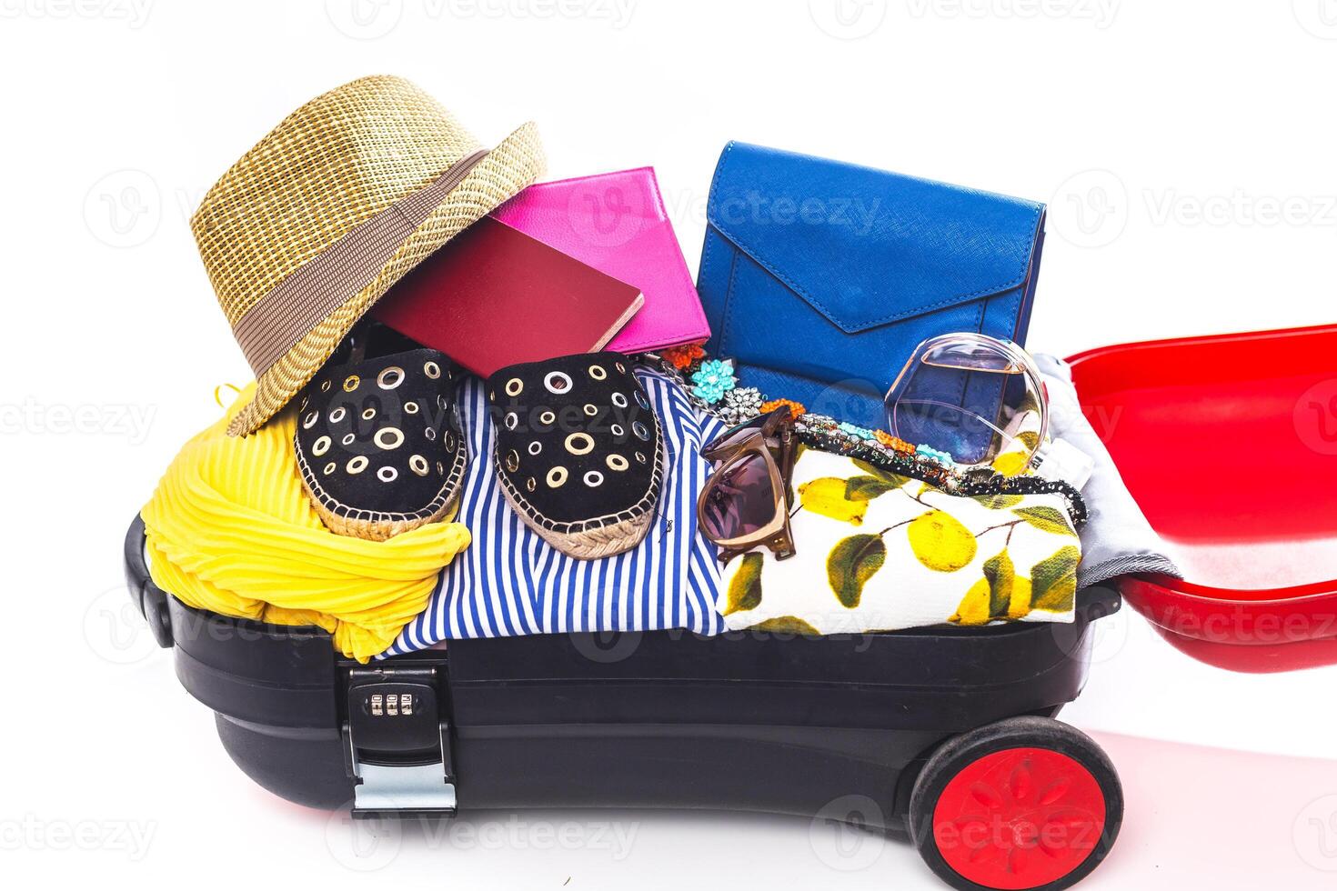 Packing suitcase for trip isolated on white photo